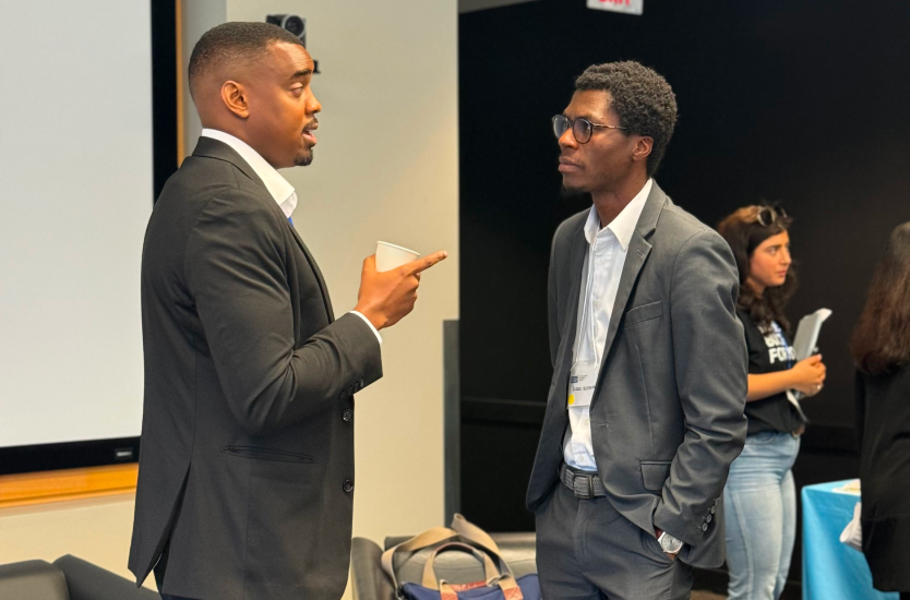 Panelist Ubong Umoh talking to an attendee