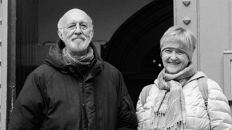 Cathy and Beric standing next to the Toronto Homeless Memorial Sign