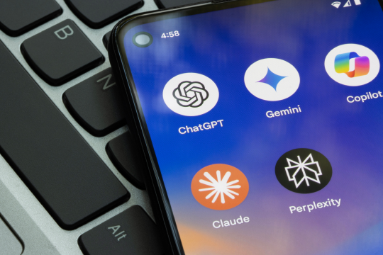 ChatGPT, Gemini, Microsoft Copilot, Claude, and Perplexity app icons are seen on a Google Pixel smartphone.