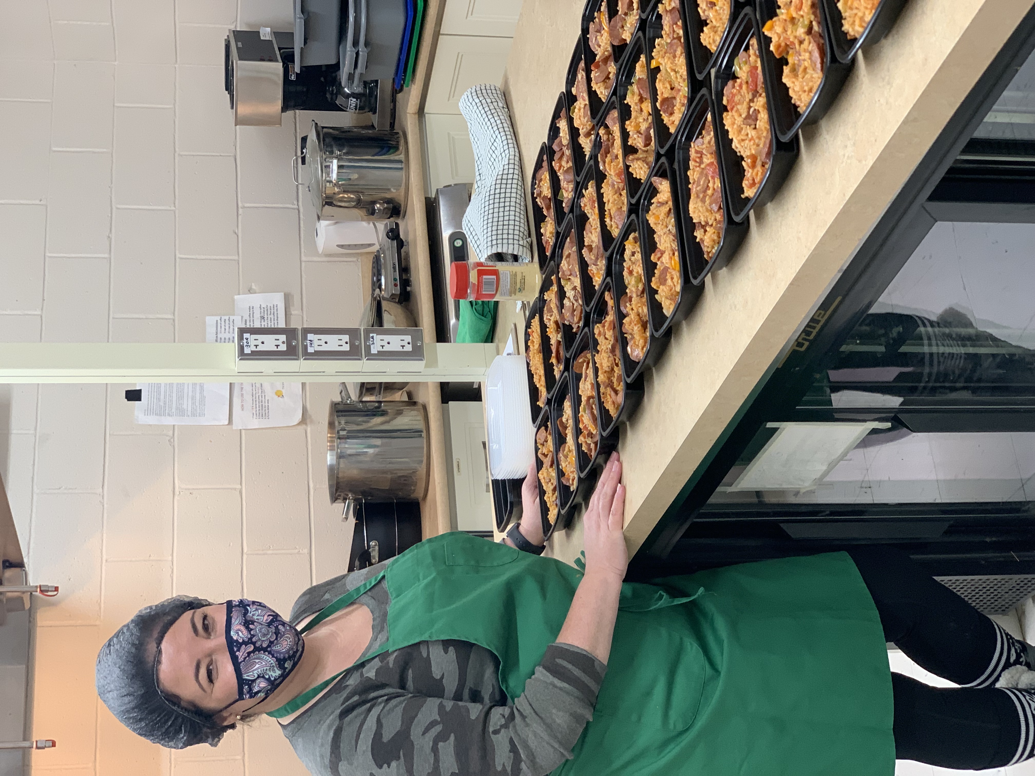 Volunteer preparing food