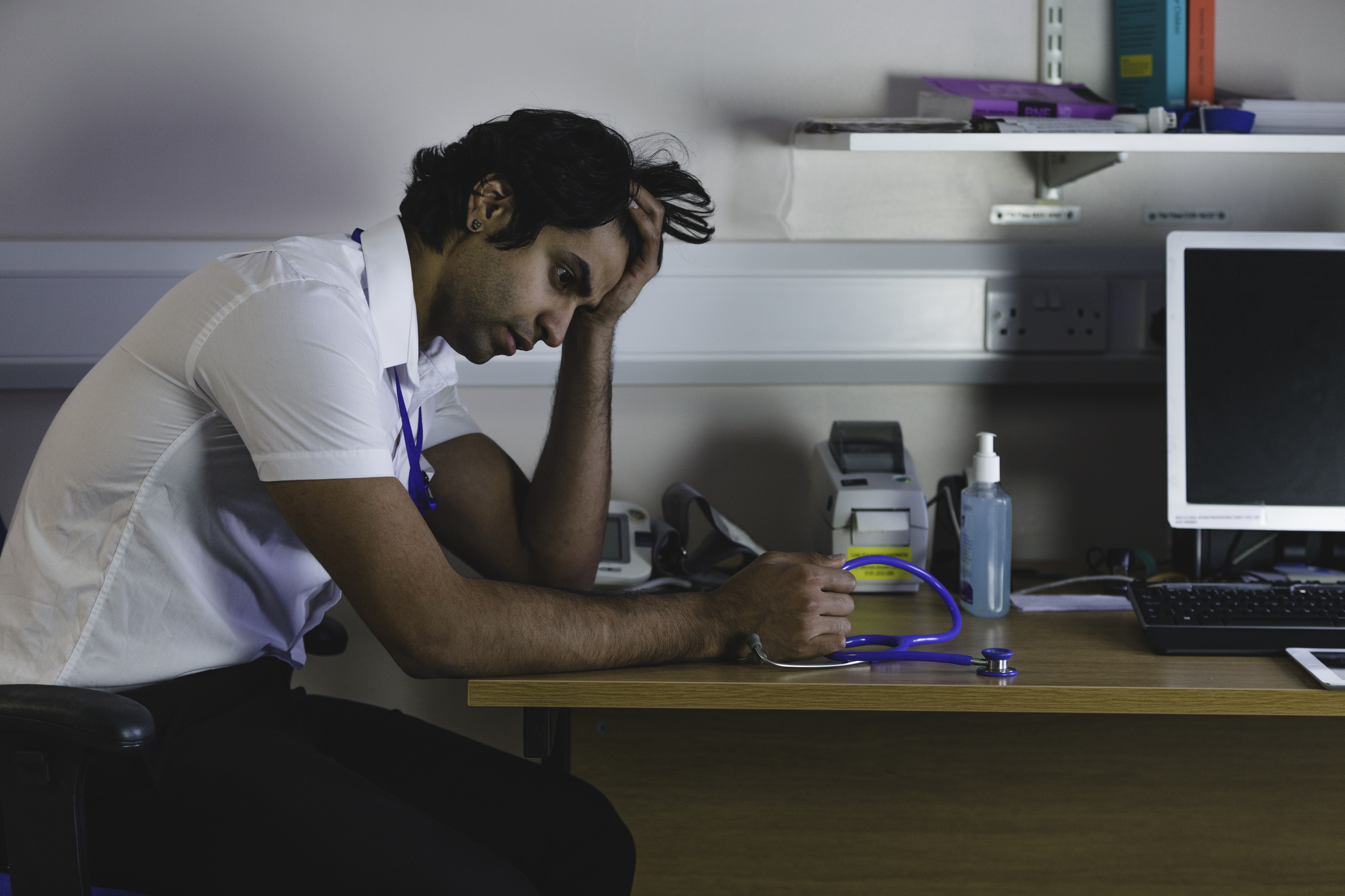 Man at desk combatting burnout