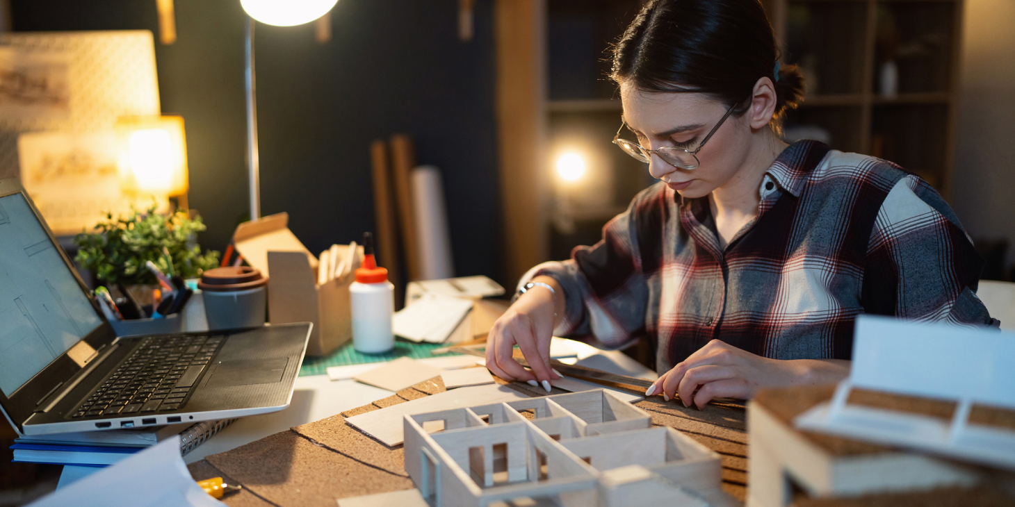 Architect working on a model of a building