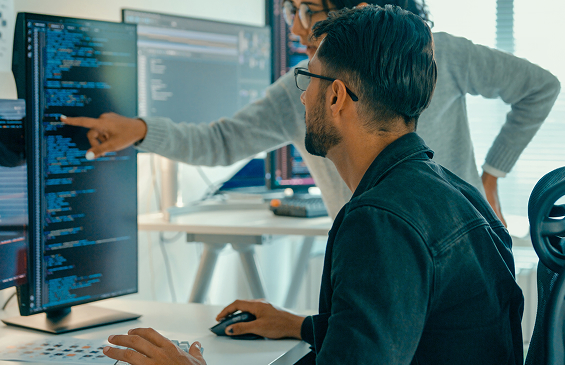 Data science and machine learning specialists collaborate to discuss analyses and recommendations from AI-assisted data analytics projects 

