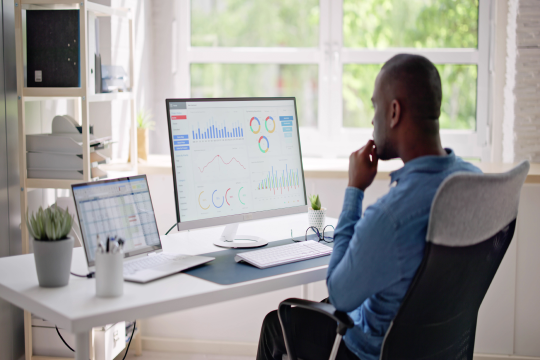 Professional working on search engine optimization strategy and website performance analysis.