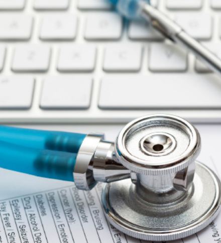 stethoscope on a keyboard and new patient information form