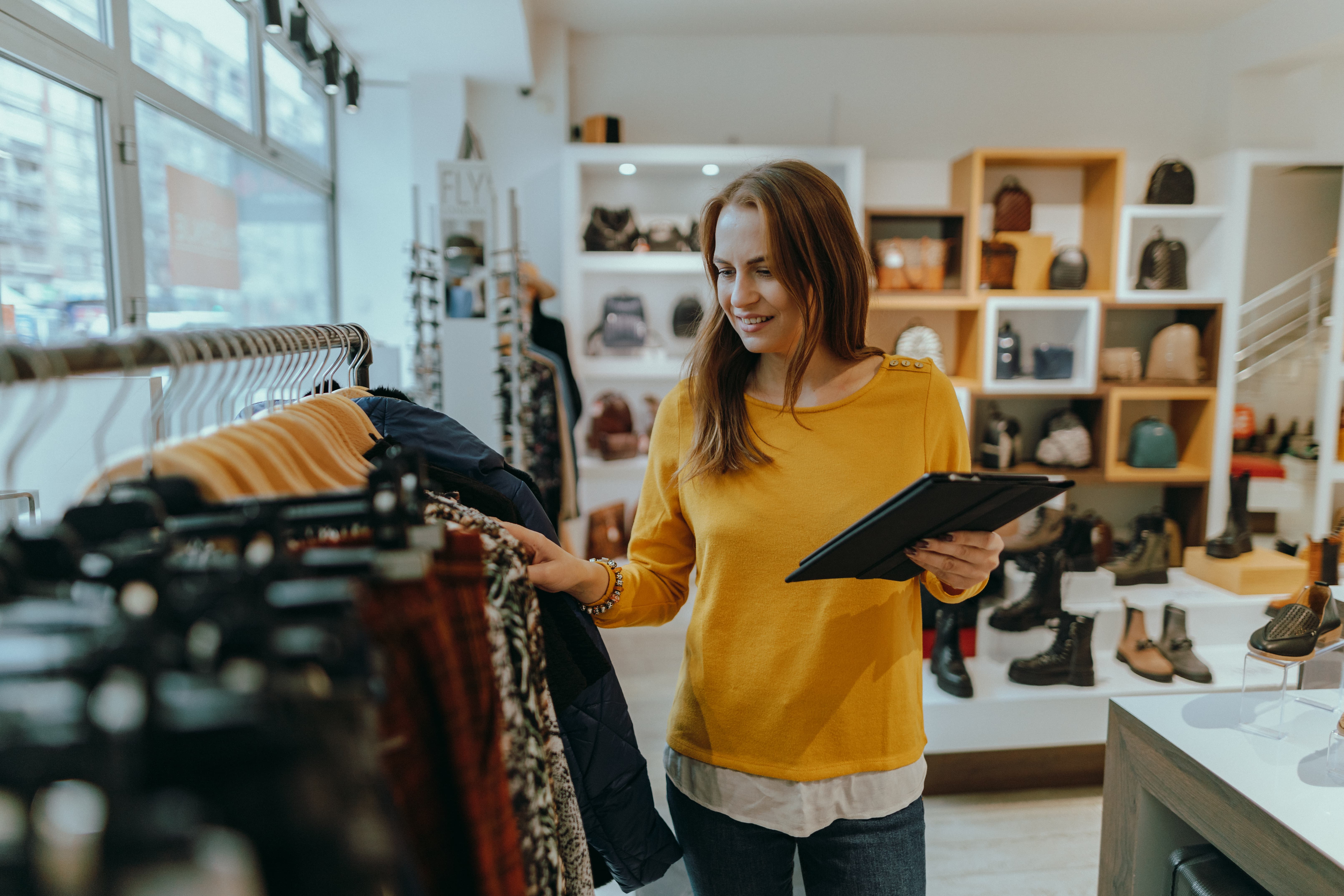Woman taking inventory in a fashion store
