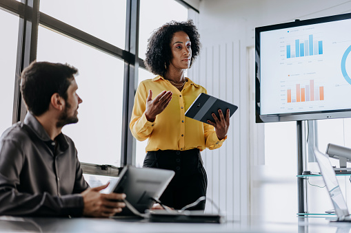 Business woman presenting using a tablet